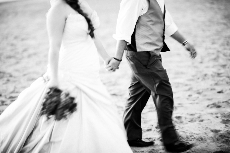 wedding photograph of groom and bride walking