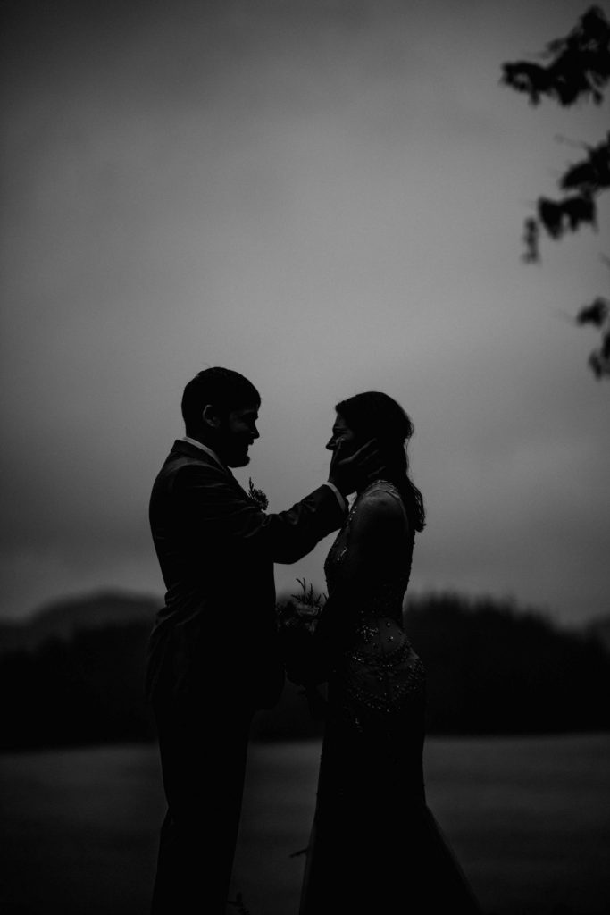 silhouette of bride and groom on a rainy day