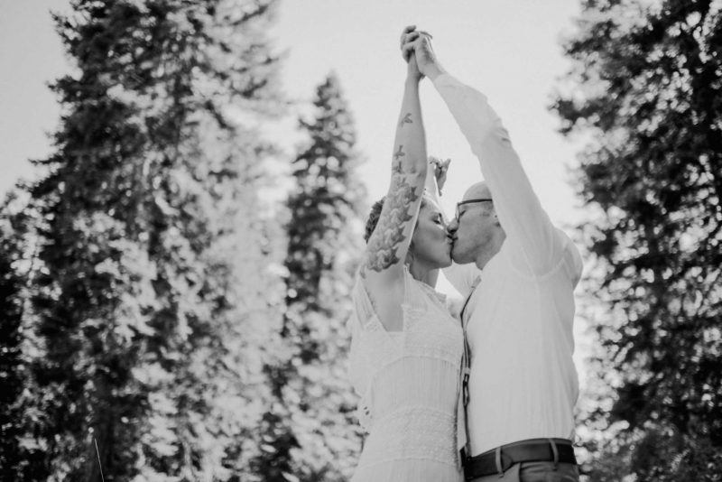 bw bride and groom holding hands at willow ranch by wedding photographer lindsey bolling