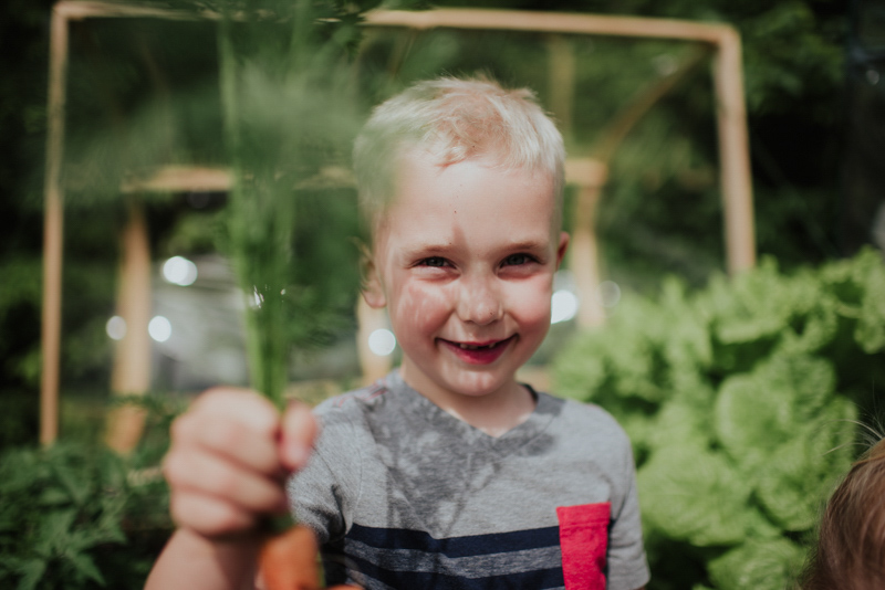 Kids with organic carrot