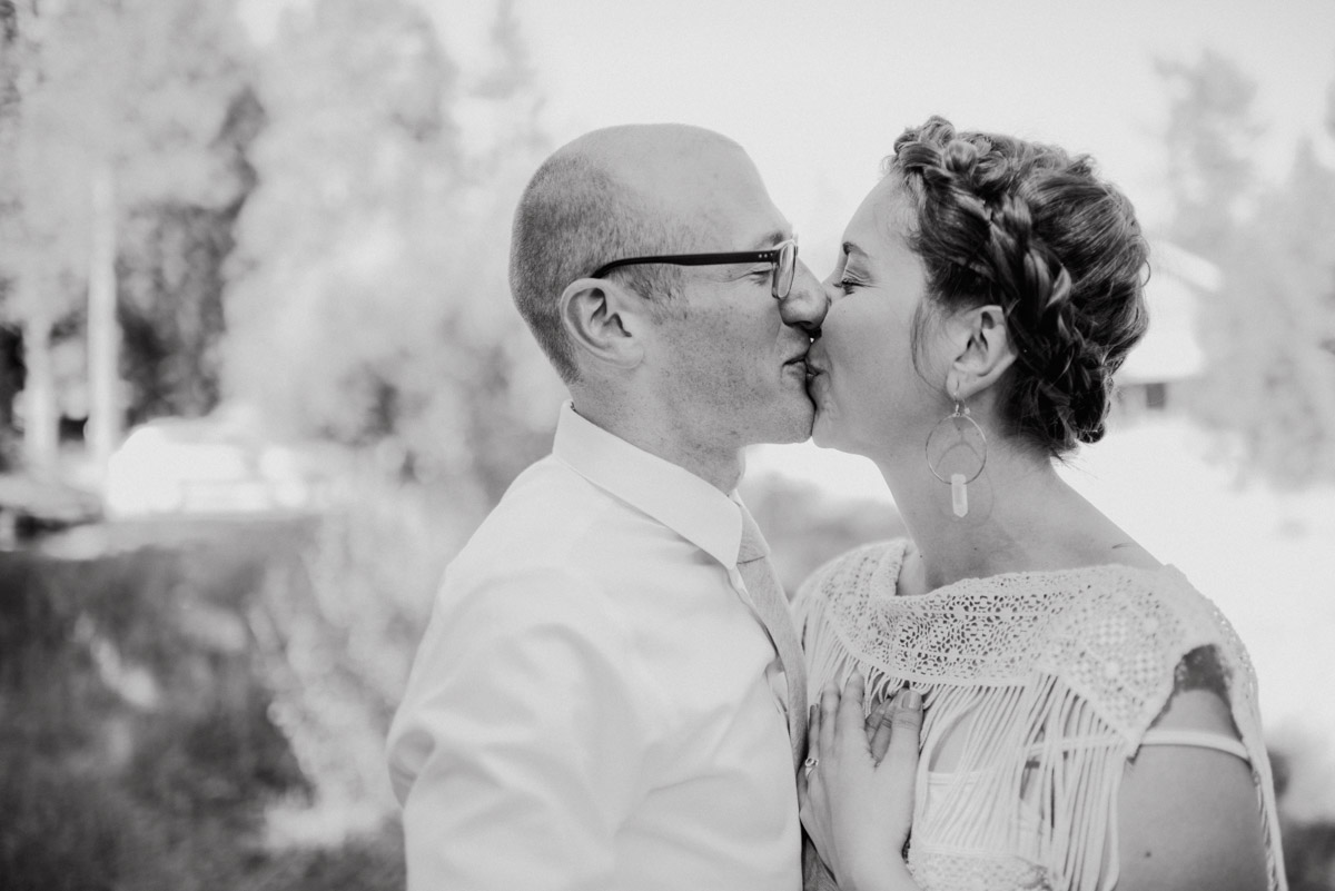 Intimate bride and groom kissing