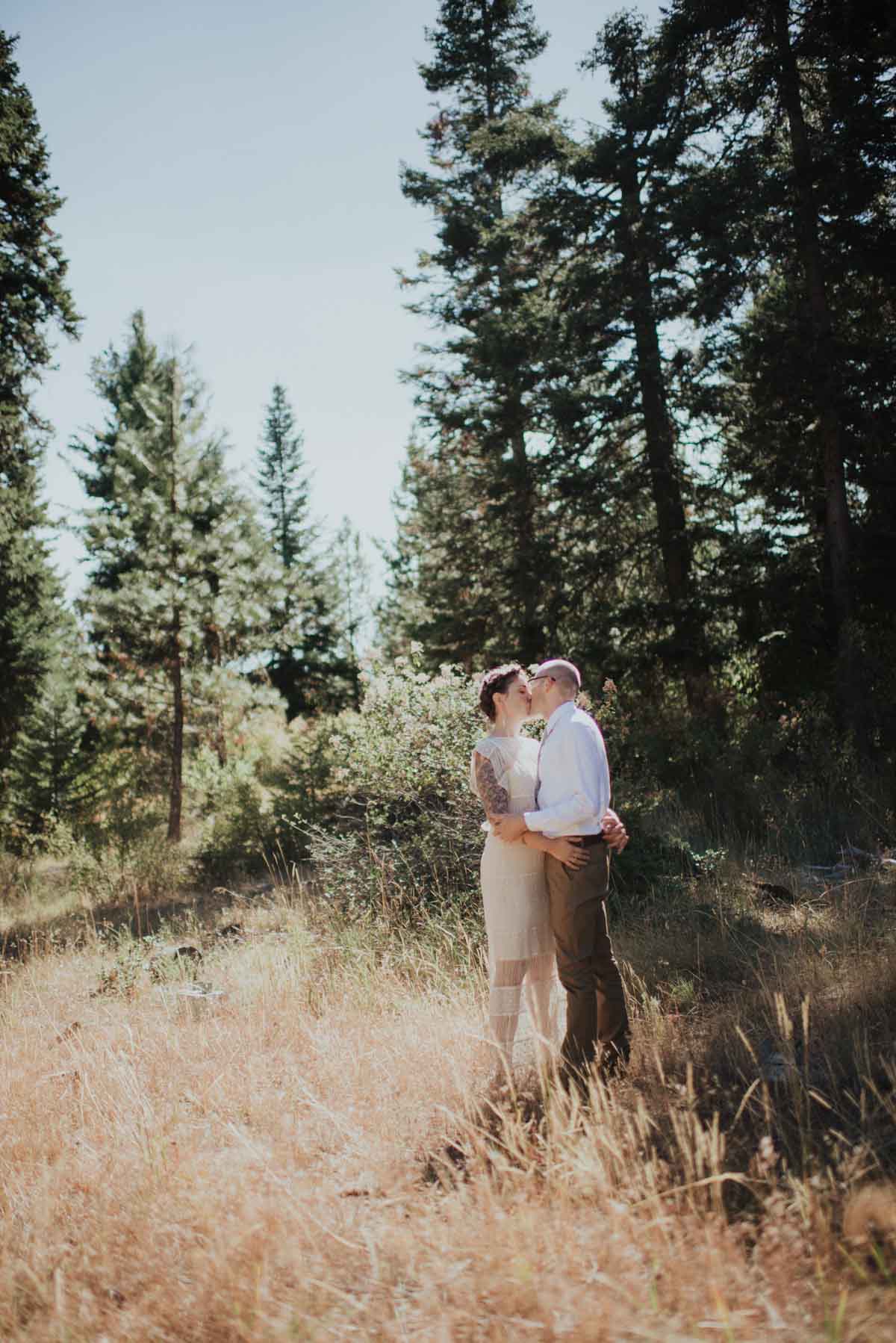 Bride and Groom Kissing Outside