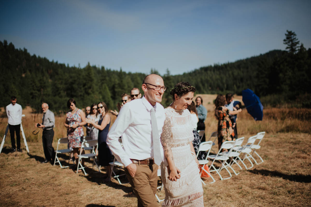 Bride and Groom Walking Down The Isle