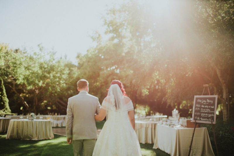 bride and groom leaving the ceremony at Wisteria Garden Wedding