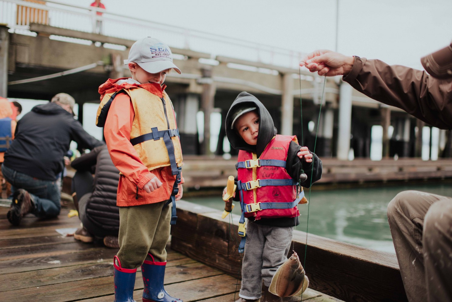 Kid Fishing with Dad in Alaska by Lindsey Bolling