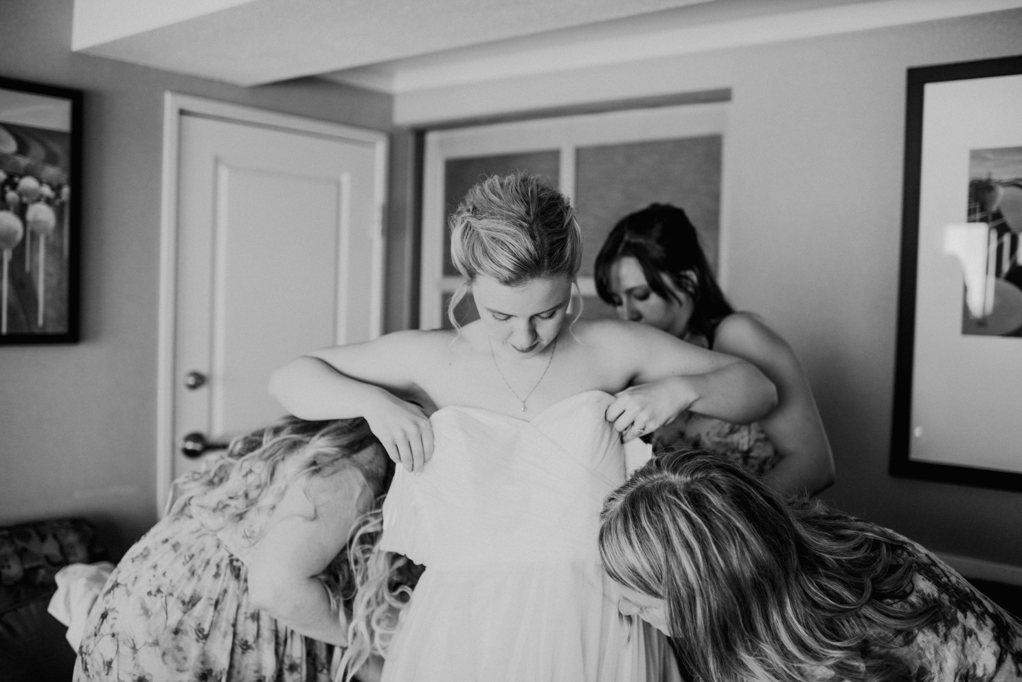 Bride Putting Dress on 