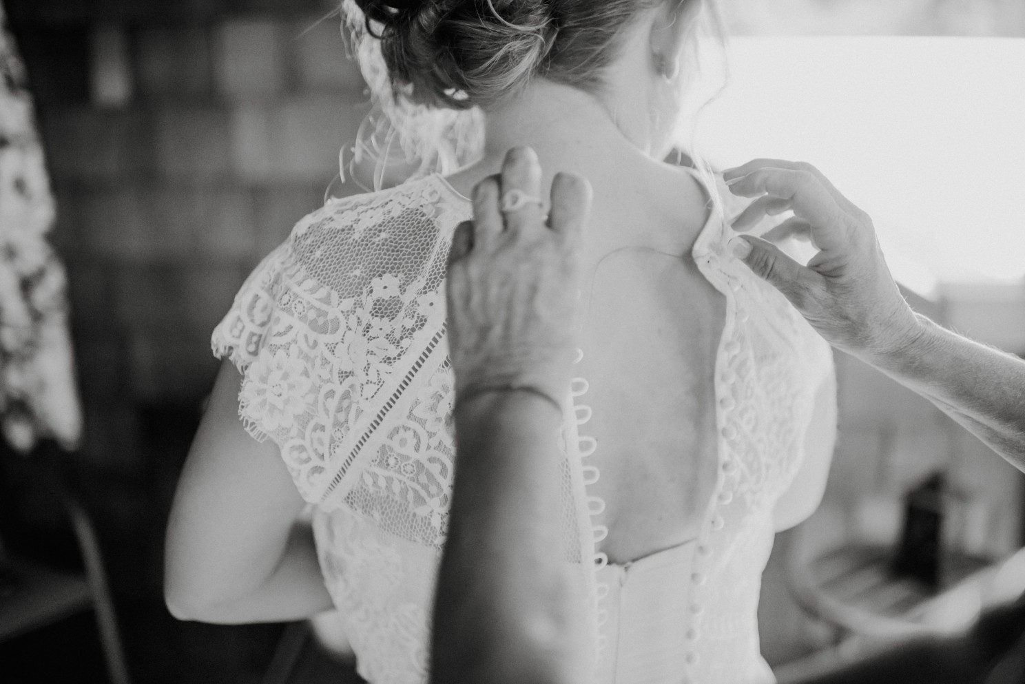 bride putting dress on