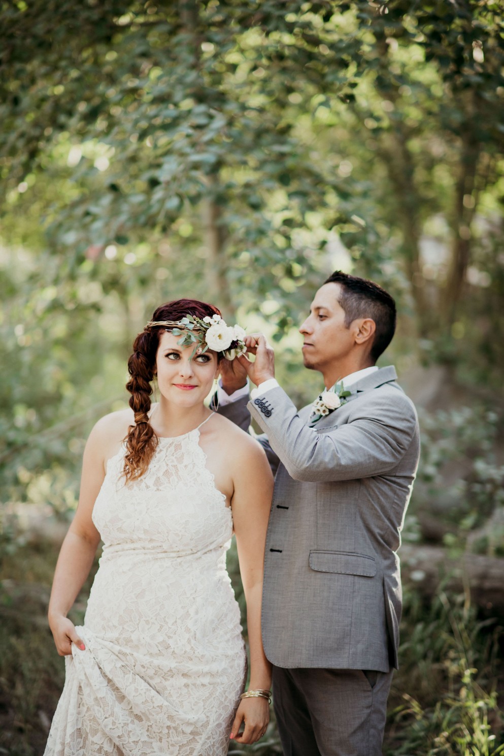 Groom helping Bride with Crown