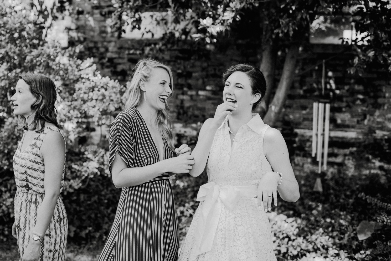 bride and friend laughing