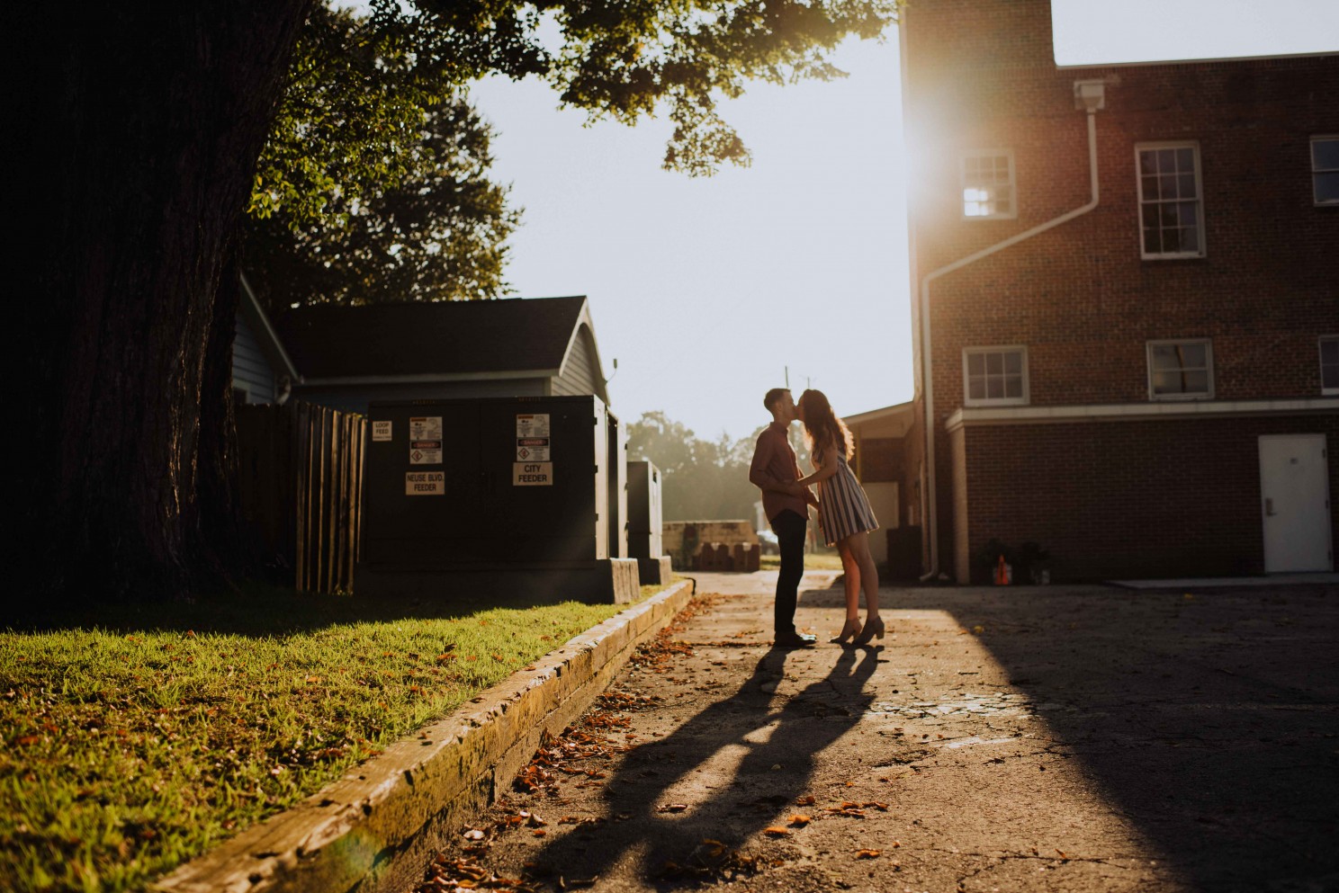 couple kissing at sunrise