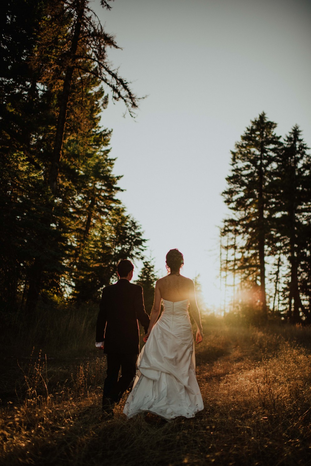 bride and groom at sunset