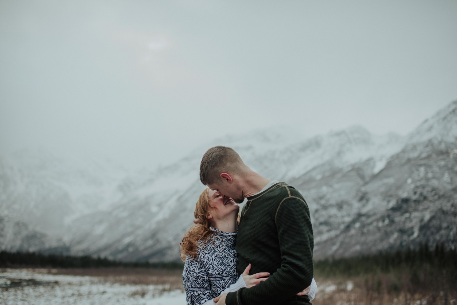 couple kissing in snow