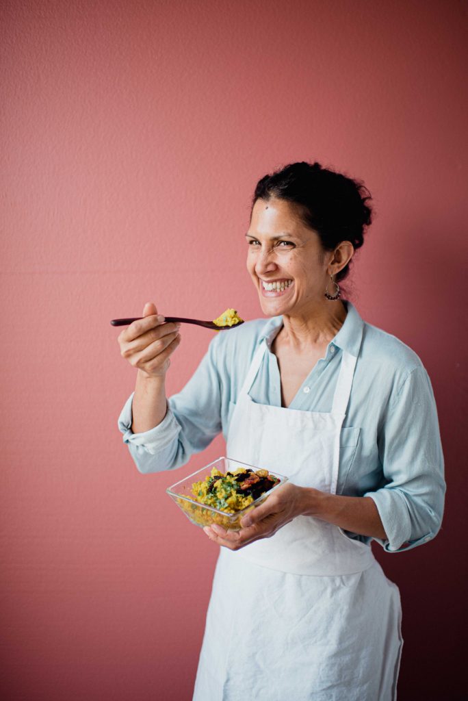 Woman smiling and eating